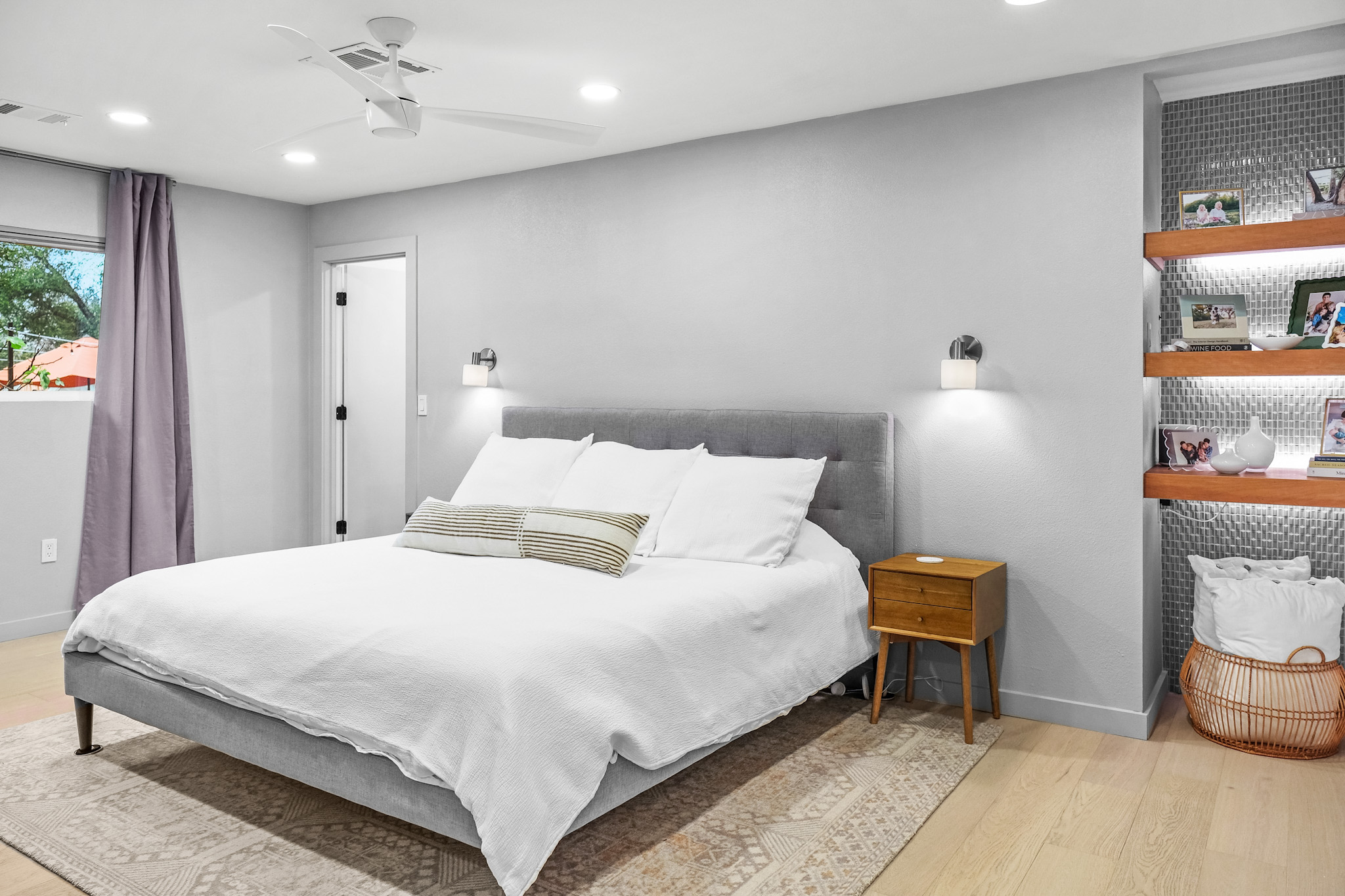 Primary bedroom with floating shelves